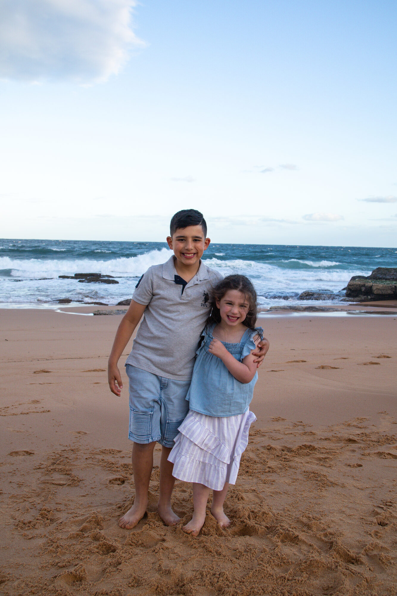 Family photography Sydney — siblings on the beach